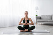 © Prostock-studio - Happy calm european pretty young blonde lady practicing yoga, sitting in lotus position with closed eyes