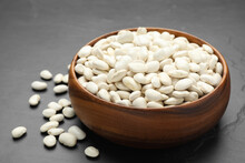 Raw White Beans On Black Table, Closeup