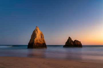 Wall Mural - rock lit at sunset at Alvor beach, algarve, Portugal