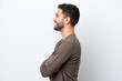 © luismolinero - Young Brazilian man isolated on white background in lateral position