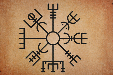 Ancient magical sign of Scandinavian mythology runic compass on grunge background