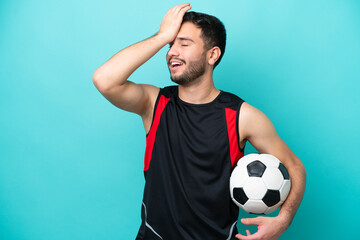 Wall Mural - Young football player Brazilian man isolated on blue background has realized something and intending the solution