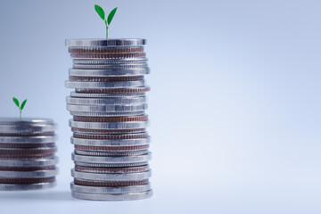 Wall Mural - Stacking of coins for growing growth financial and business background. Savings and Accounts, Finance Banking Business Concept, Investments, Funds, Bonds, Dividends, Interest, Plants growing on top.