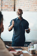 © Nola Viglietti/peopleimages.com - Leadership starts with self-confidence. Shot of a businessman giving a presentation to his colleagues in a boardroom.