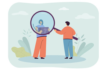 Canvas Print - man looking through magnifier at girl holding tablet with interrogation mark. survey of target audie