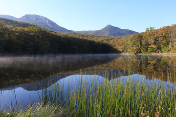 Wall Mural - Beautiful lake among the forest and mountains