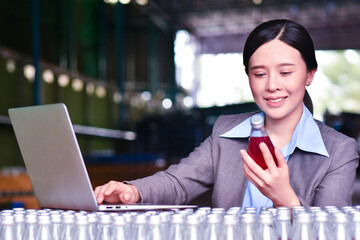 Young asian woman manager or trainee staff work and checks the number of items store by Computer technology. Asian owner or small business concept.