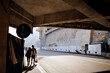 Exit from the famous tunnel in Monaco. Formula 1 Grand Prix. Silhouettes of two people walking on the sidewalk.