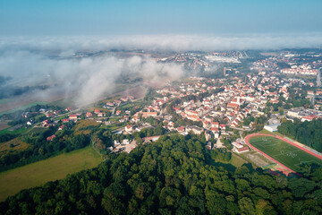 Wall Mural - Aerial view of european city with architecture buildings and streets. Central square of small town cityscape, top view