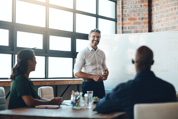 Aufkleber - Sharing important updates with the team. Shot of a businessman giving a presentation to his colleagues in a boardroom.