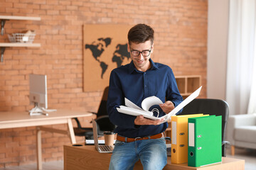 Poster - Young man with open folder in office