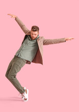 Cool Dancing Young Man On Color Background