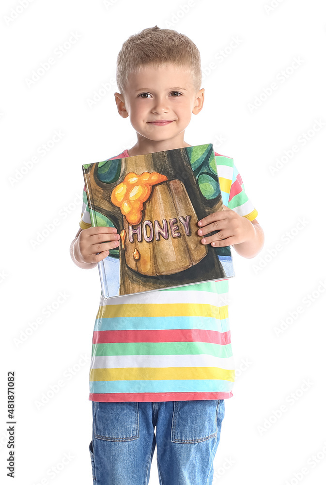 Adorable little boy with book on white background