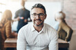 © Nola Viglietti/peopleimages.com - Make each day a success. Cropped portrait of a businessman sitting in the boardroom during a presentation.
