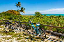 Two Bikes Parked At A Beach In Bahia Honda State Park - Florida.