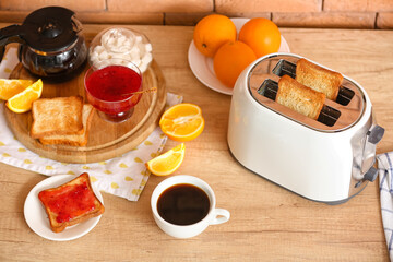 White toaster with tasty breakfast on counter near brick wall