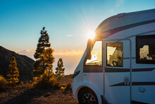 Beautiful Sunset In Background And Modern Camper Van Parked In The Nature To Enjoy Freedom And Vanlife Alternative Lifestyle. Travel People Family And Tourism Concept