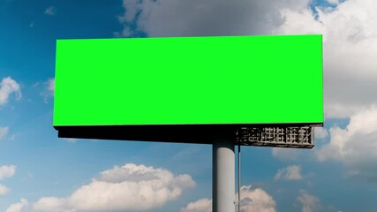 Wall Mural - timelapse - blank wide green billboard or large display and moving white clouds against blue sky. co