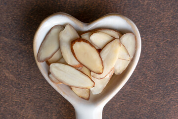 Wall Mural - Slivered Almonds on a Heart Shaped Spoon