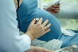© narong - Close up doctor use stethtroscope to listen baby sound in belly of pregnant woman. Concept of medicare for pregnant woman and support good health.