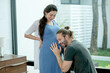 © narong - Husband sit and try to hear baby by ear attach to pregnant woman tummy and he look happy.