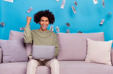 Sticker - Photo of young guy rejoice victory fists hand use laptop air fly money income benefit isolated over blue color background