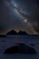 Canvas Print - Digital composite image of Milky Way and Epic Absolutely beautiful landscape images of Holywell Bay beach in Cornwall UK