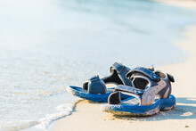 A Pair Of Sandals On A Tropical Beach