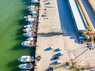 Wall Mural - Aerial view of the port with small fishing boats at the evening