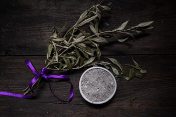 bowl with ashes and olive branch. ash wednesday concept