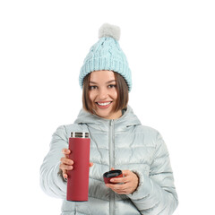 Wall Mural - Beautiful young woman with thermos isolated on white