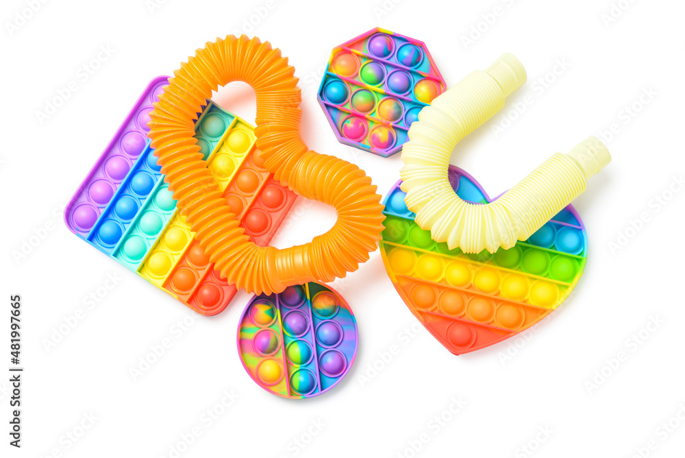 Colorful Pop Tubes and Pop it fidget toys  on white background