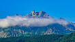 Majestic Mount Pilatus with blue sky is surrounded by clouds