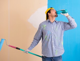 Wall Mural - Painter man painting the wall at home