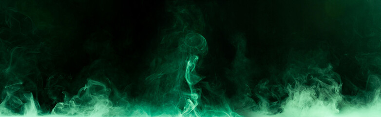 Wall Mural - Green steam on a black background