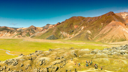 Wall Mural - Famous Icelandic landscape in highlands, Landmannalaugar area - Iceland. Green lava fields and mountains on the background, aerial view from drone