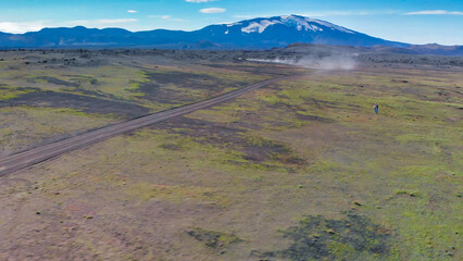 Wall Mural - Famous Icelandic landscape in highlands, Landmannalaugar area - Iceland. Green lava fields and mountains on the background, aerial view from drone