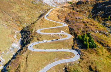 Wall Mural - a road with turns through a mountain pass. aerial landscape. an aerial summer landscape in the dolom