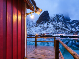 Wall Mural - view on the house in the lofoten islands, norway. landscape in winter time during blue hour. mountai
