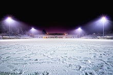 Snowy Soccer Stadium, Football Stadium Covered With Snow Sport Field In The Dark