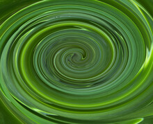 Swirling Green Colors Creates Circular Pattern.