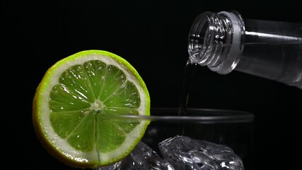 Wall Mural - pouring soda water in glass of ice