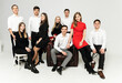 © Vadym - group of young people on a white background. brothers and sisters. company of friends in formal wear on a white background