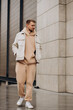 © Petro - Young handsome man walkin in the street