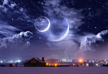 Wall Mural - Winter landscape, a house on a hill, night city lights and a fantastic space with a double moon