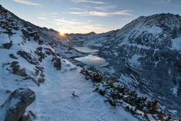 Wall Mural - beautiful winter views of the high tatra mountains with tourists, skiers and amazing states of natur