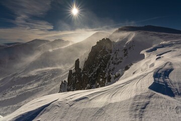Wall Mural - beautiful winter views of the high tatra mountains with tourists, skiers and amazing states of natur