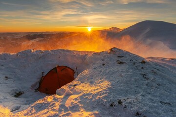 Wall Mural - beautiful winter views of the high tatra mountains with tourists, skiers and amazing states of natur