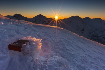 Wall Mural - beautiful winter views of the high tatra mountains with tourists, skiers and amazing states of natur