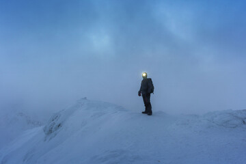 Wall Mural - beautiful winter views of the high tatra mountains with tourists, skiers and amazing states of natur
